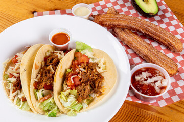 A Mexican fast food dinner of tacos and churros