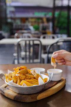 Potato fries Served With Dipping Sauces at a Restaurant