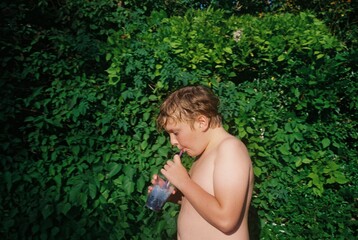 a child drinking blue juice