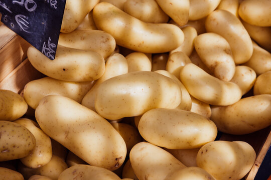 Fresh Potatoes Displayed at a Local Market in Sunny Weather