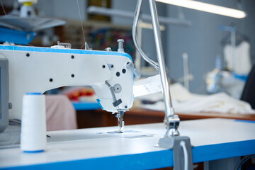 Precise industrial sewing, high-precision industrial stitching on blue surface