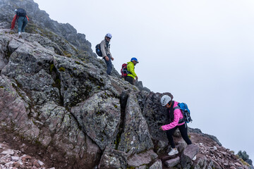 Group hiking rocky terrain on malinche volcano in mexico