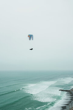 Paragliding over the ocean in Lima, Peru 