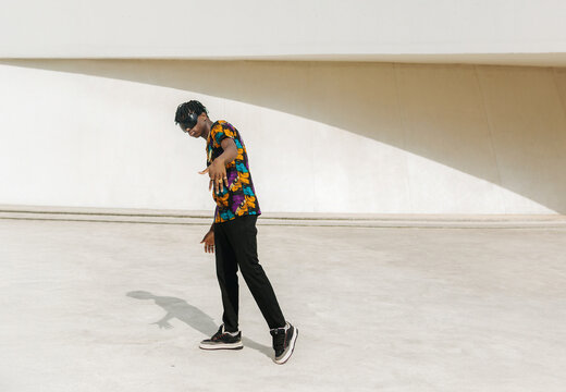Young boy striking dynamic pose portrait