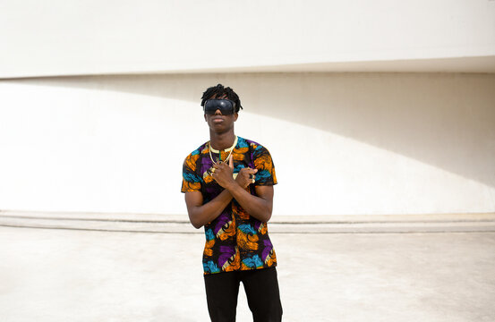 Male model with crossed arms in bright space portrait