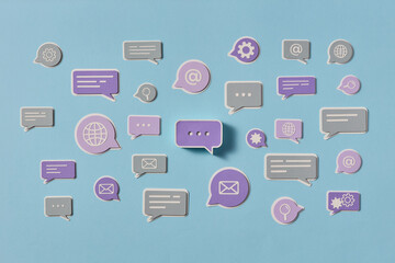 Papercraft communication bubbles on blue background