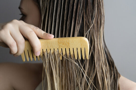 Detangling Long Blonde Wet Hair with Comb