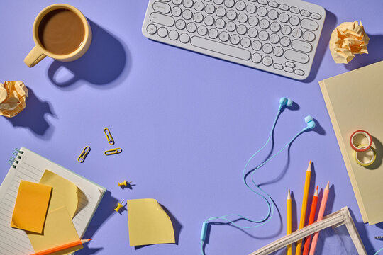 Aesthetic workspace layout with coffee, stationery, and a keyboard