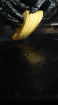 Tortillas warm on a grill in vertical slow motion, with gentle steam rising to emphasize heat, texture, and the atmosphere of traditional outdoor taco cooking Taco Stand Series - Food vendor