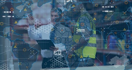 Pointing manager in tie and hi-vis vest worker checking stock on tablet at warehouse with overlay