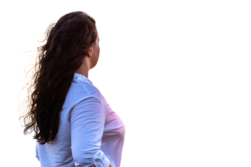 Female engineer inspecting wind turbine operation with long hair flowing. PNG background