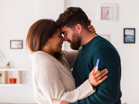 Excited couple happy with pregnancy test result