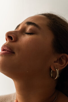 Emotional woman crying at home