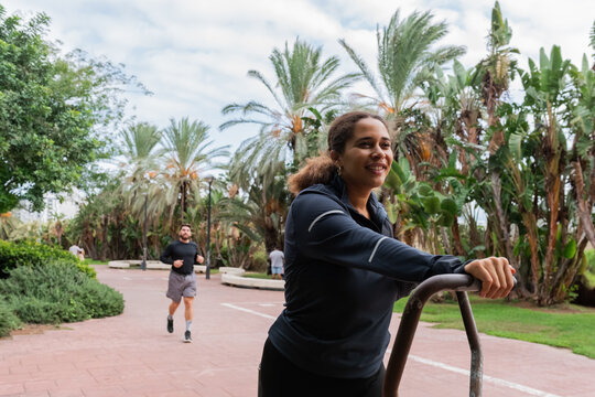 Couple exercising in park 