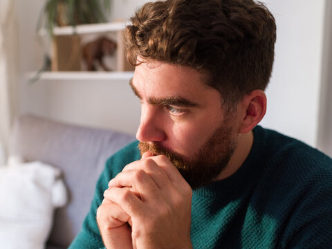 Man in Deep Thought With a Focused Expression at Home