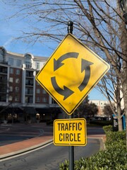 Yellow and black traffic circle graphic sign