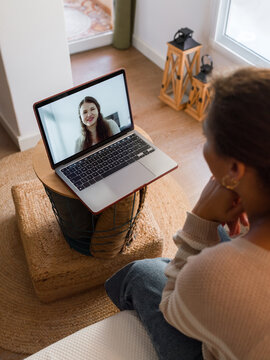 Woman talking to counsellor  during online therapy session