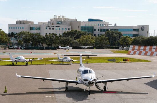 St Petersburg, Florida, U.S - Jan 3, 2026 - University of South Florida&rsquo;s C.W. Bill Young Complex overlooks active airfield with light aircraft and aviation signage.