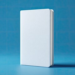 Blank white book on a blue surface