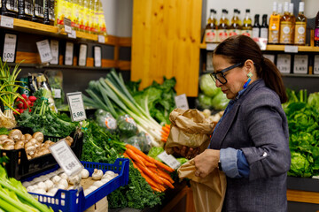 Woman Shops for Vegetables at Indoor Market 