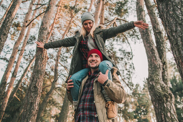Couple travelers is so fun in the forest. Concept of trekking, adventure and seasonal vacation.