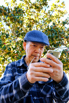 senior using mobile phone