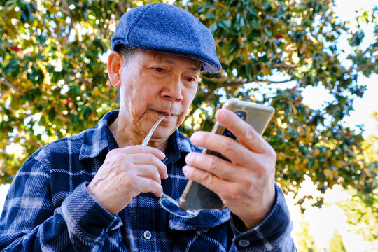 senior using mobile phone