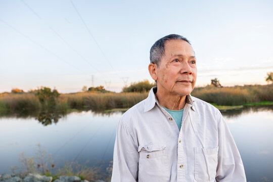 portrait of older man by river