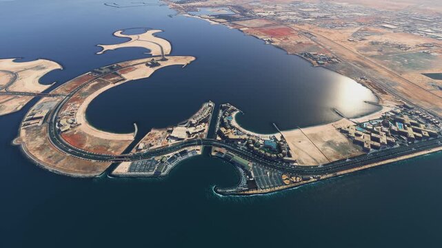 Side aerial drone view of Al Marjan Island Beach in Jazeerat Al Marjan. Ras Al Khaimah. United Arab Emirates
