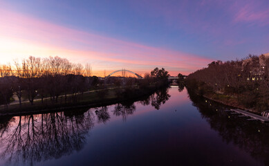 Obraz premium Blue and pink sunset twilight reflection on the Guadiana River in Merida Spain ESP
