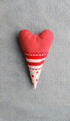 Handmade red spotted and striped heart shape cushion