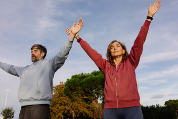 A couple of active adults training functional exercises