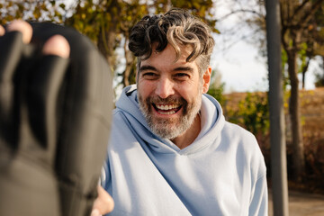 Older man practices martial arts with a senior fitness coach
