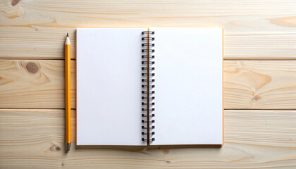 Open notebook with pencil on wooden table viewed from directly above in natural daylight