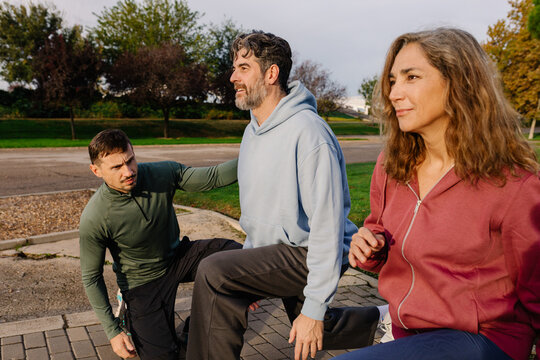 Specialist oversees strength and functional workout of an older couple