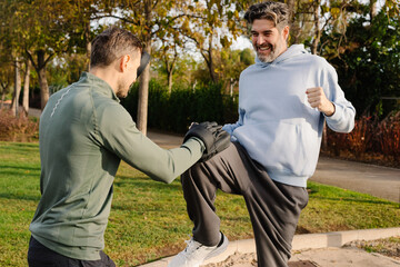 A senior man works on martial arts techniques