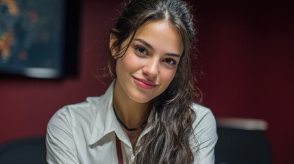 Beautiful Young Woman Smiling and Posing for a Portrait in Professional Setting