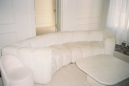 White curved modular sofa in modern living room