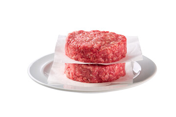 plate with raw ground beef patties for hamburgers isolated on white background.