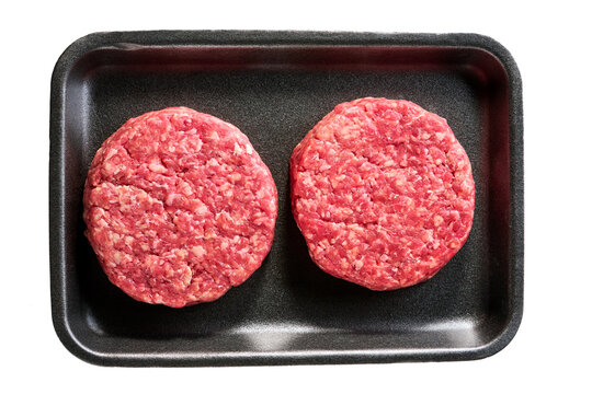 raw hamburger patties in a plastic container isolated on a white background, top view.