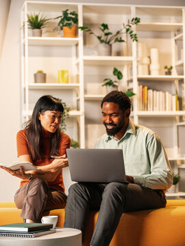 Collaborative Work Session Between Friends With Laptop, Notebook