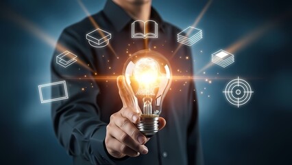 Businessman holding lightbulb with digital icons.