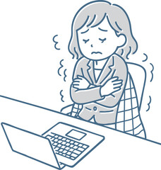 オフィスで寒さに震える女性