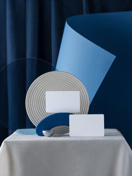Abstract composition with blank business cards on a table