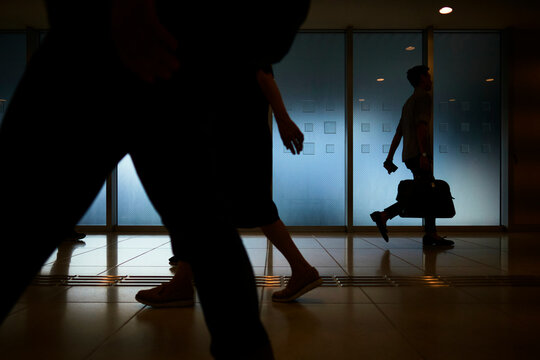 Busy City Environment With Silhouetted People in Motion
