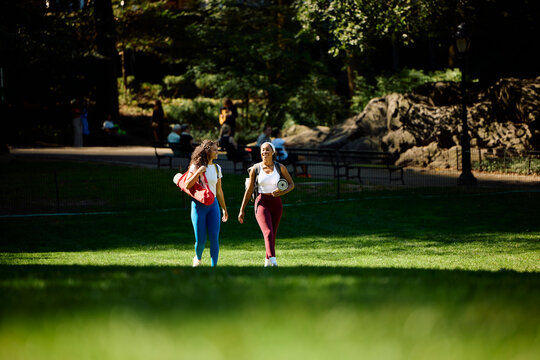 Athlete women stroll in the park