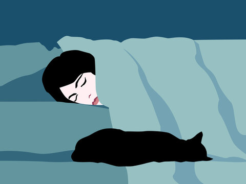 Woman sharing bed with a cat