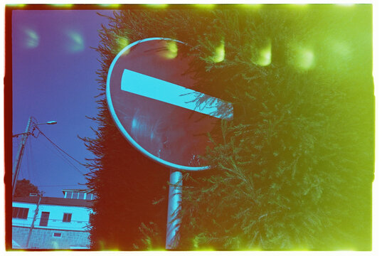 No Entry Sign in Foliage with Film Burn