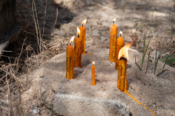 Candles while burning on the ground during Lanna traditional worship ceremony in Northern region of Thailand. In Lanna region of Thailand they believed burning the candle in ceremony to remove bad luc