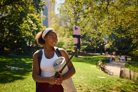 Sportswoman snap selfies in the park